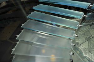 Bonded glass and metal staircase