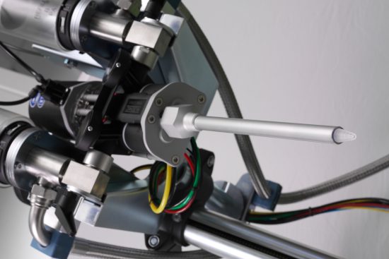 MIXPAC Statomix mixer attached to dispensing machine with shroud