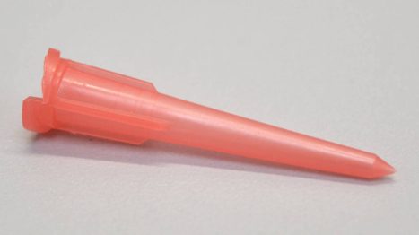 Double tapered smooth flow dispensing tip