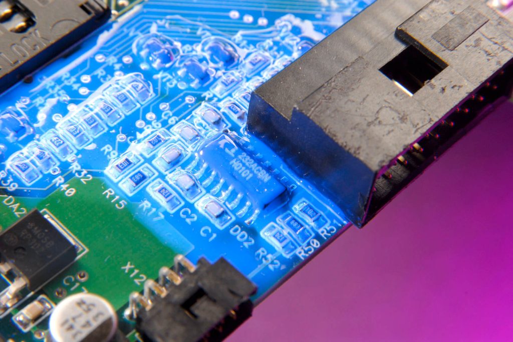Low viscosity conformal coating cures with light