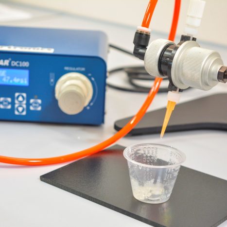 Pinch tube system dispensing cyanoacrylate adhesive